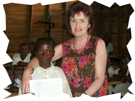 Martine with a Sponsored child who is holding a letter for his sponsor